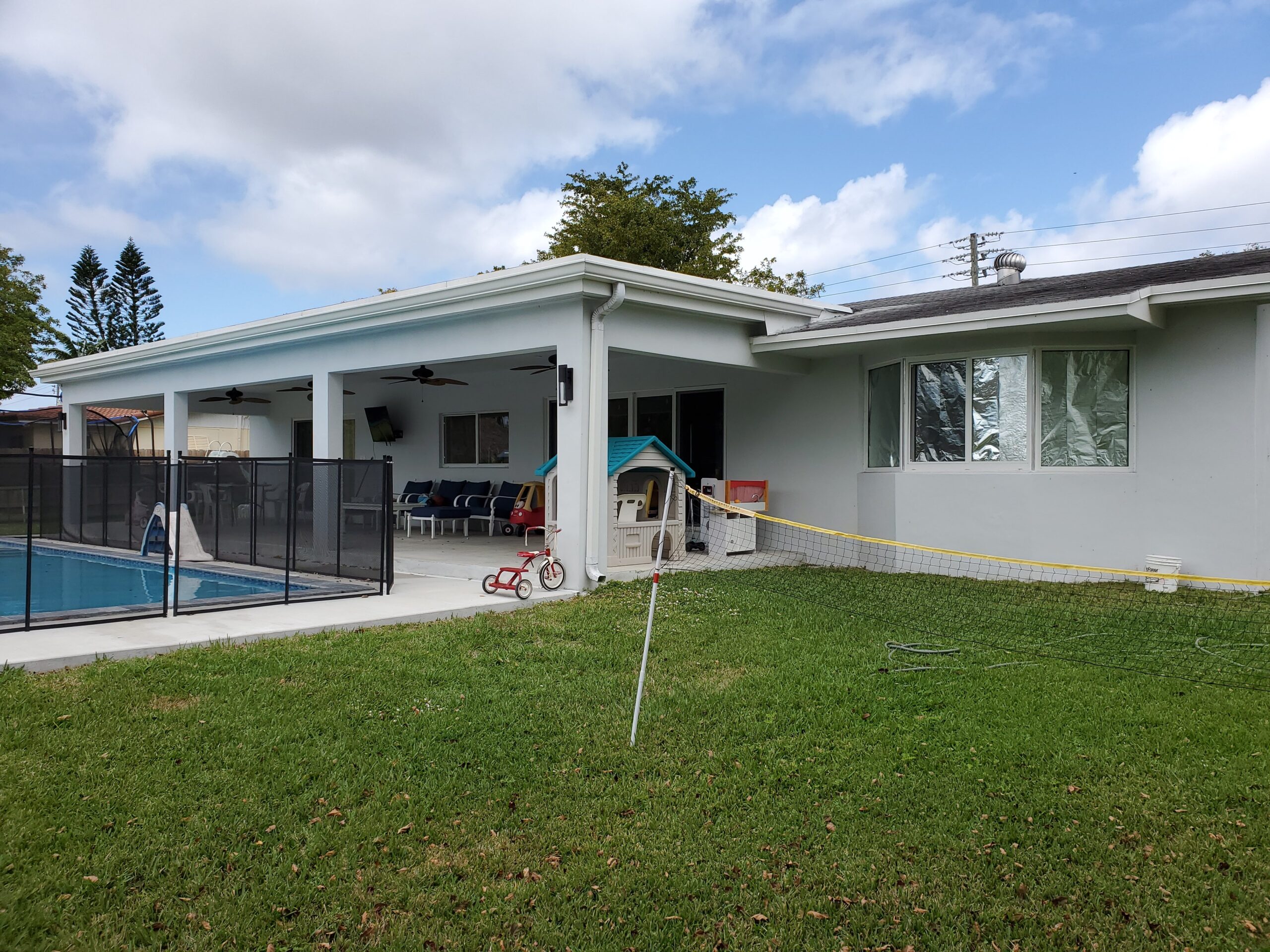 Jobsite photo: completed covered patio and pool safety enclosure