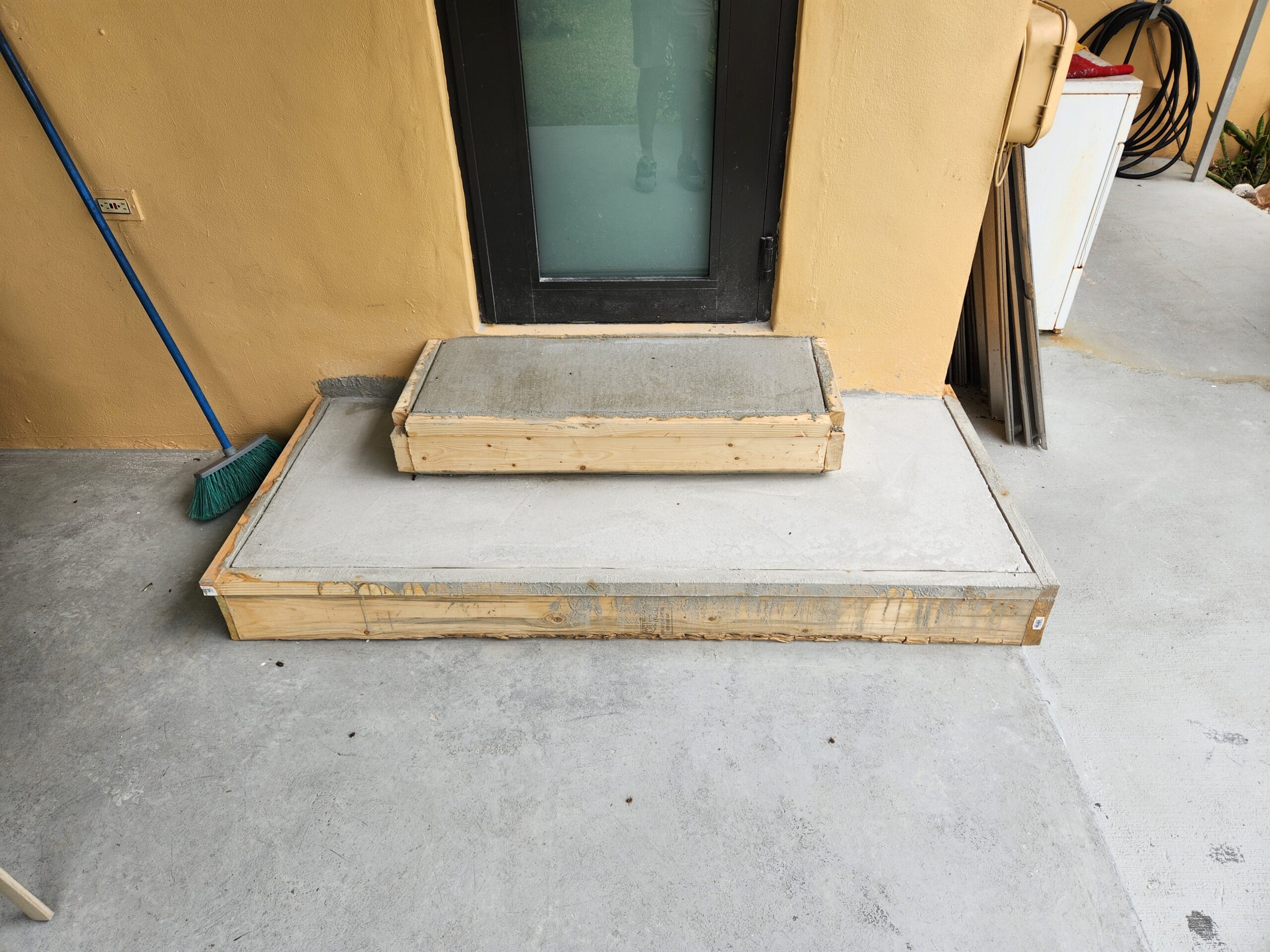 Jobsite photo: concrete entry steps rebuild during curing
